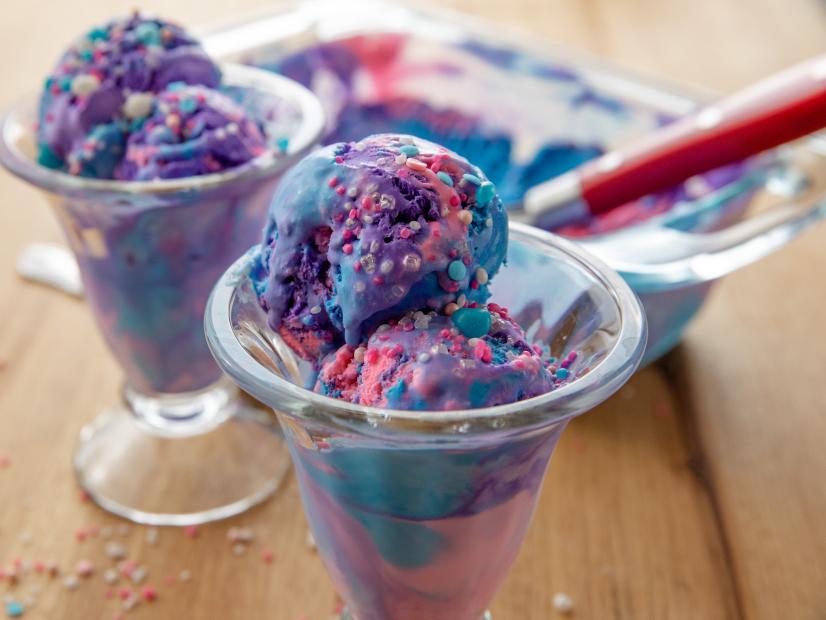 Disher Scoop with Blueberry Ice Cream Over Bowl Stock Image